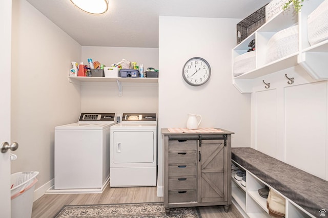 638 E Canyon Rim Rd N, Smithfield, UT 84335 - clothes washing area featuring washer and dryer and light hardwood / wood-style floors