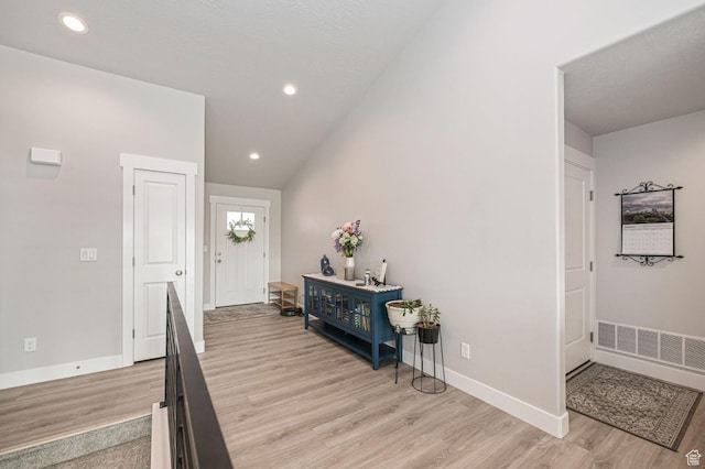 638 E Canyon Rim Rd N, Smithfield, UT 84335 - foyer entrance featuring light hardwood / wood-style floors and lofted ceiling