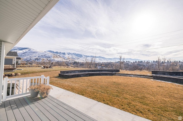 638 E Canyon Rim Rd N, Smithfield, UT 84335 - wooden terrace with a mountain view and a lawn