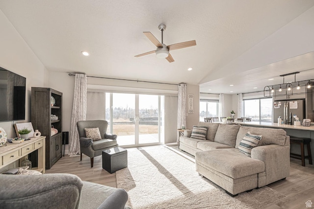 638 E Canyon Rim Rd N, Smithfield, UT 84335 - living room with ceiling fan, light hardwood / wood-style flooring, and vaulted ceiling
