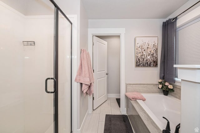 638 E Canyon Rim Rd N, Smithfield, UT 84335 - bathroom with separate shower and tub and tile patterned flooring