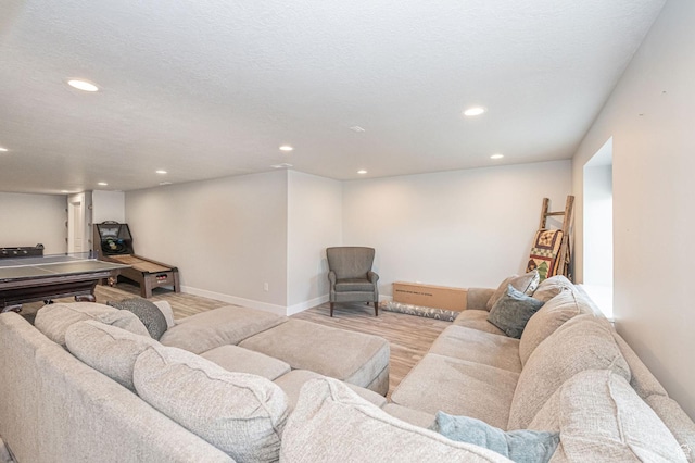 638 E Canyon Rim Rd N, Smithfield, UT 84335 - living room with light hardwood / wood-style floors and a textured ceiling