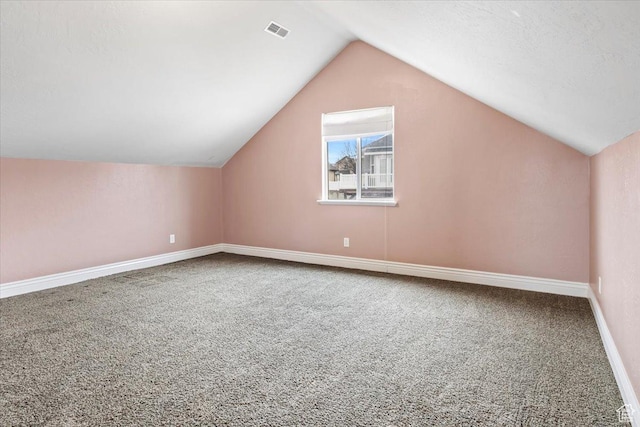 2493 S Aster Way, Saratoga Springs, UT 84045 - additional living space with carpet, visible vents, vaulted ceiling, and baseboards