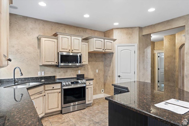 2493 S Aster Way, Saratoga Springs, UT 84045 - kitchen featuring recessed lighting, dark stone countertops, stainless steel appliances, a sink, and light tile patterned flooring
