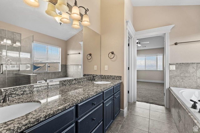 2493 S Aster Way, Saratoga Springs, UT 84045 - full bathroom featuring tiled tub, vaulted ceiling, a sink, and double vanity