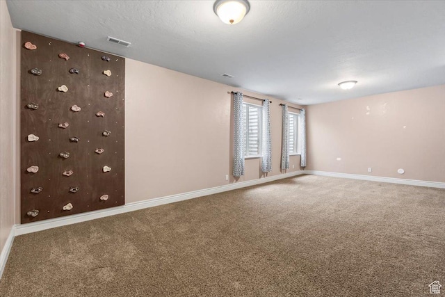 2493 S Aster Way, Saratoga Springs, UT 84045 - spare room featuring a textured ceiling, carpet, visible vents, and baseboards