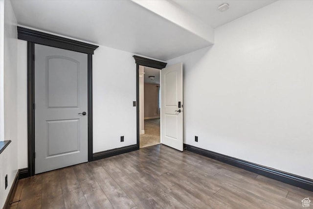 2493 S Aster Way, Saratoga Springs, UT 84045 - unfurnished bedroom featuring dark wood-style flooring and baseboards