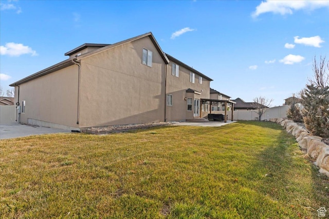 2493 S Aster Way, Saratoga Springs, UT 84045 - back of house featuring a yard, a fenced backyard, stucco siding, and a patio