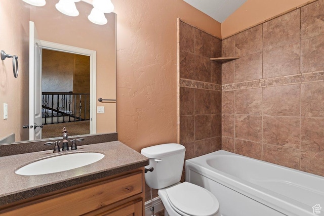 2493 S Aster Way, Saratoga Springs, UT 84045 - full bathroom with washtub / shower combination, a textured wall, vanity, and toilet