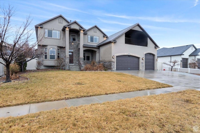 2493 S Aster Way, Saratoga Springs, UT 84045 - view of front of house featuring driveway, an attached garage, fence, a front lawn, and stucco siding