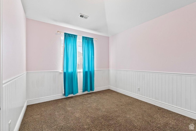 2493 S Aster Way, Saratoga Springs, UT 84045 - empty room with visible vents, vaulted ceiling, carpet flooring, and wainscoting