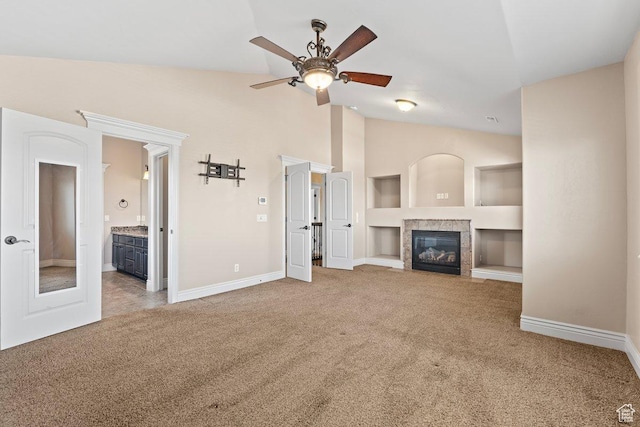 2493 S Aster Way, Saratoga Springs, UT 84045 - unfurnished living room with baseboards, a ceiling fan, carpet, vaulted ceiling, and a fireplace