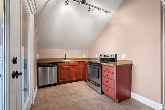 2493 S Aster Way, Saratoga Springs, UT 84045 - kitchen with lofted ceiling, baseboards, appliances with stainless steel finishes, and a sink