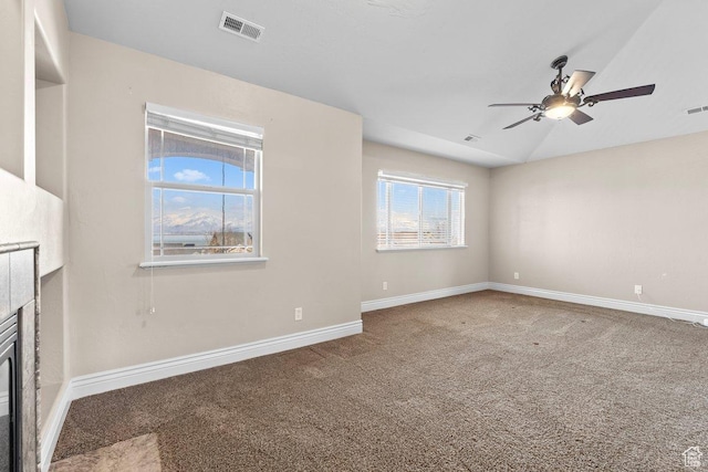 2493 S Aster Way, Saratoga Springs, UT 84045 - unfurnished living room with carpet, a tile fireplace, visible vents, and baseboards