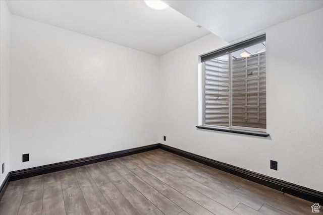 2493 S Aster Way, Saratoga Springs, UT 84045 - spare room with baseboards and wood finished floors