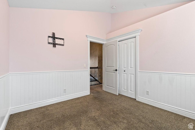 2493 S Aster Way, Saratoga Springs, UT 84045 - unfurnished bedroom featuring a wainscoted wall, vaulted ceiling, carpet, and a closet