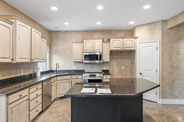 2493 S Aster Way, Saratoga Springs, UT 84045 - kitchen with a center island, recessed lighting, appliances with stainless steel finishes, light brown cabinets, and a sink