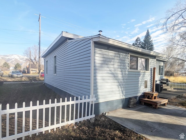 934 S Main St, Springville, UT 84663 - view of home's exterior with a mountain view and a patio area