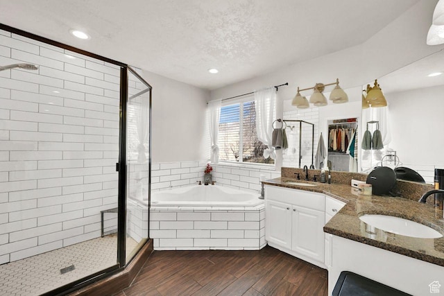 582 W 3900 N, Pleasant View, UT 84414 - bathroom with vanity, separate shower and tub, and a textured ceiling