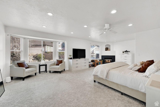 582 W 3900 N, Pleasant View, UT 84414 - bedroom with multiple windows, light carpet, and ceiling fan