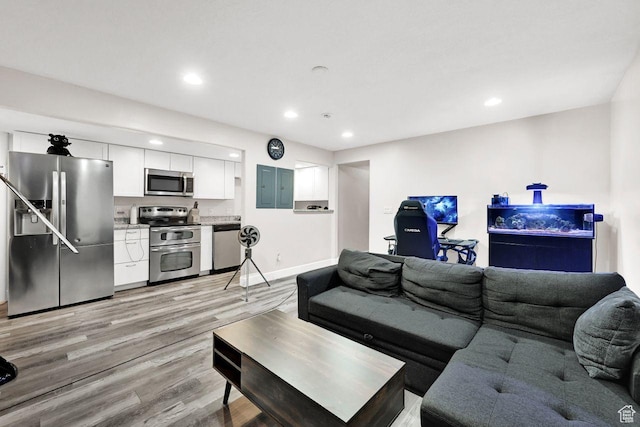 582 W 3900 N, Pleasant View, UT 84414 - living room with light wood-type flooring and electric panel