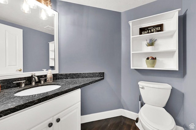 582 W 3900 N, Pleasant View, UT 84414 - bathroom with wood-type flooring, vanity, a textured ceiling, and toilet