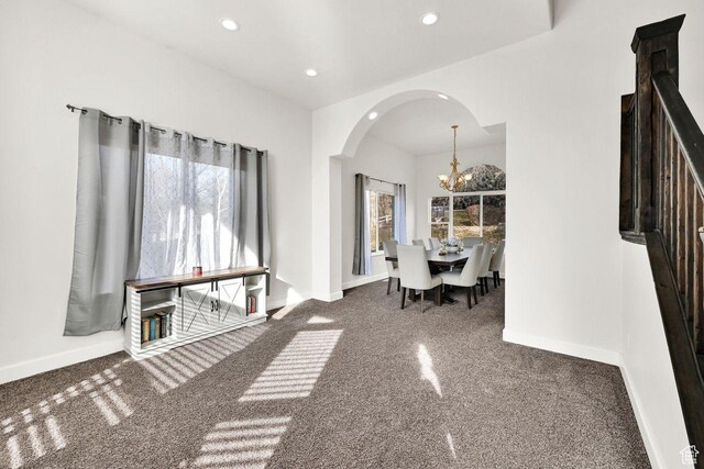 582 W 3900 N, Pleasant View, UT 84414 - unfurnished dining area featuring carpet and an inviting chandelier