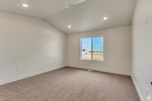706 W Osborne Way S Unit 803, Grantsville, UT 84029 - carpeted spare room with vaulted ceiling