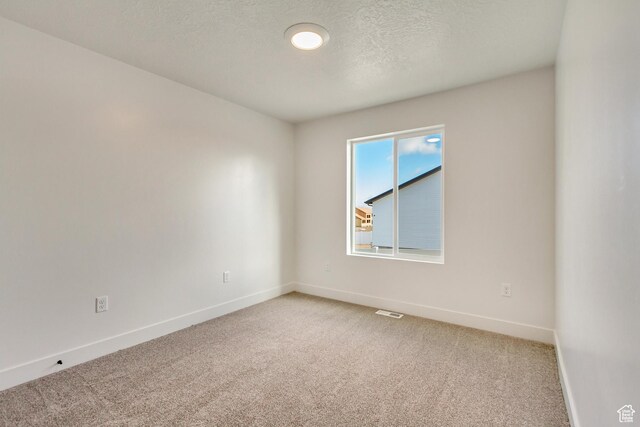 706 W Osborne Way S Unit 803, Grantsville, UT 84029 - carpeted spare room featuring a textured ceiling