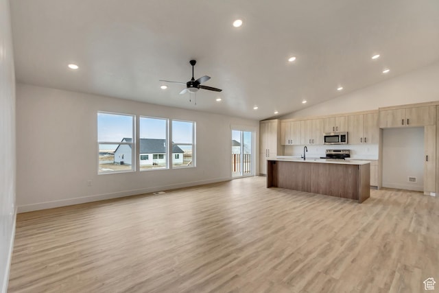 706 W Osborne Way S Unit 803, Grantsville, UT 84029 - kitchen featuring a center island with sink, sink, ceiling fan, light wood-type flooring, and appliances with stainless steel finishes