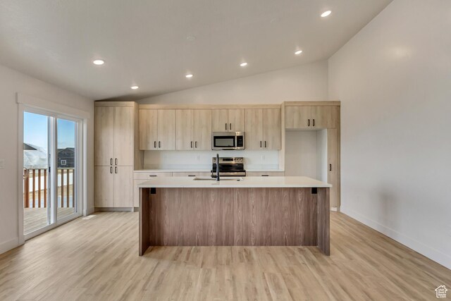 706 W Osborne Way S Unit 803, Grantsville, UT 84029 - kitchen featuring light brown cabinets, stainless steel appliances, a kitchen island with sink, and light hardwood / wood-style floors