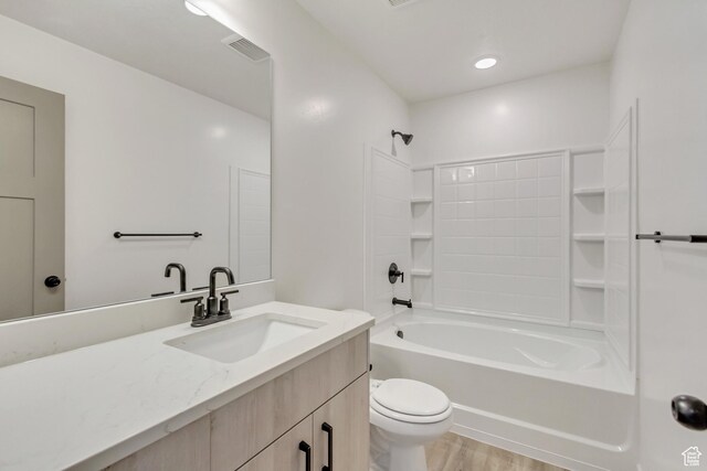 706 W Osborne Way S Unit 803, Grantsville, UT 84029 - full bathroom featuring vanity, hardwood / wood-style floors, shower / bathing tub combination, and toilet