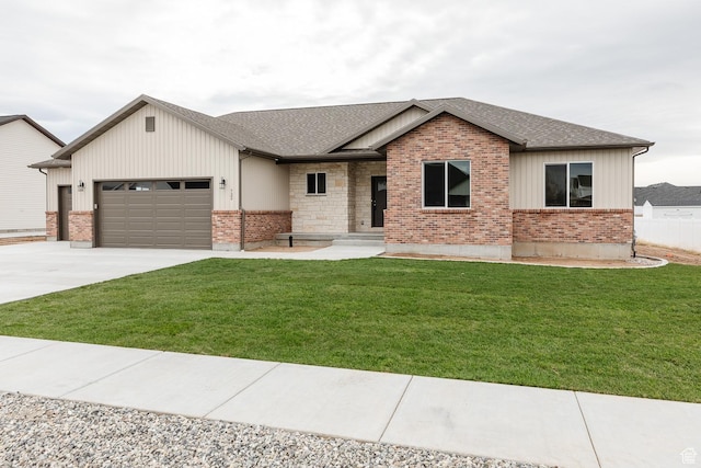 732 E 750 S, Preston, ID 83263 - view of front of property with a front yard, roof with shingles, an attached garage, and concrete driveway