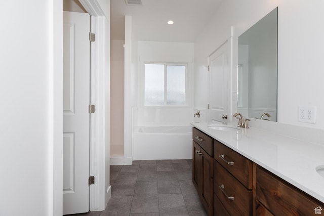 732 E 750 S, Preston, ID 83263 - bathroom featuring a garden tub, double vanity, a sink, and visible vents