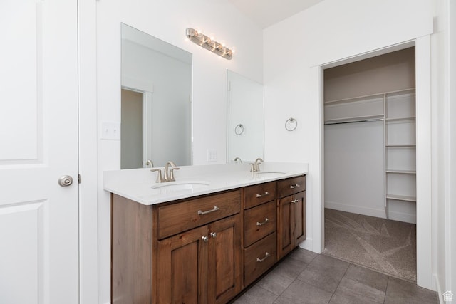 732 E 750 S, Preston, ID 83263 - full bathroom featuring tile patterned floors, double vanity, a sink, and a walk in closet