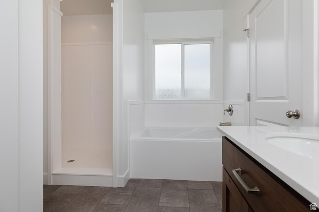 732 E 750 S, Preston, ID 83263 - full bathroom featuring a walk in shower, vanity, and a garden tub