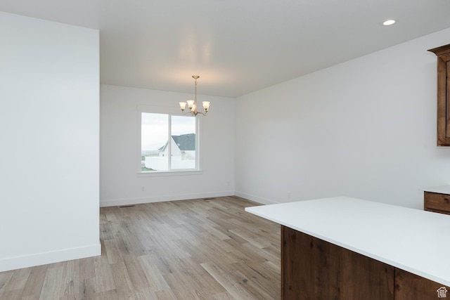 732 E 750 S, Preston, ID 83263 - unfurnished dining area featuring light wood-style floors, an inviting chandelier, baseboards, and recessed lighting