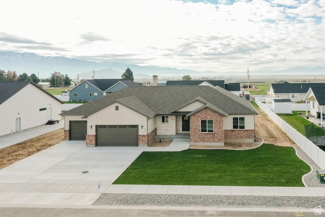 732 E 750 S, Preston, ID 83263 - ranch-style home featuring a garage, fence, a front lawn, brick siding, and concrete driveway