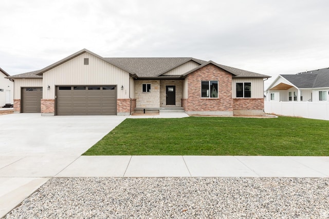 732 E 750 S, Preston, ID 83263 - view of front of home with concrete driveway, roof with shingles, a front lawn, a garage, and fence