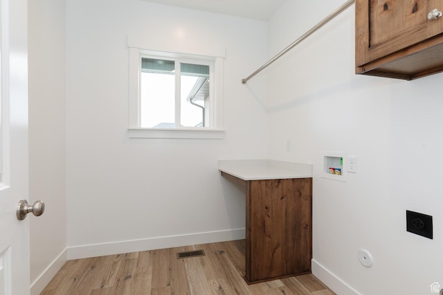 732 E 750 S, Preston, ID 83263 - clothes washing area featuring visible vents, hookup for an electric dryer, washer hookup, light wood finished floors, and cabinet space