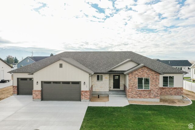 732 E 750 S, Preston, ID 83263 - view of front facade featuring a garage, roof with shingles, and board and batten siding