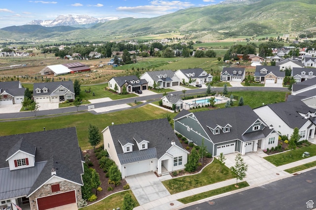 aerial view featuring a mountain view and a residential view