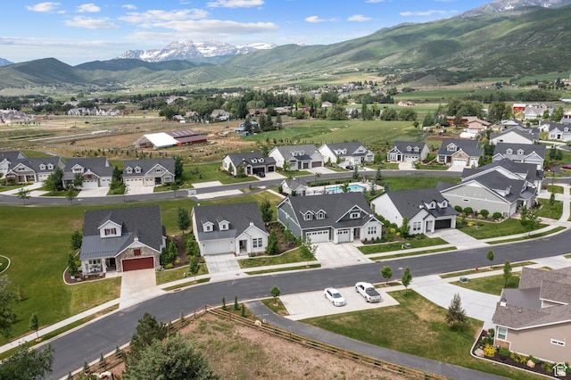 aerial view with a mountain view and a residential view