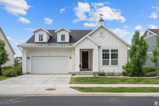 view of front of house with a garage, board and batten siding, and driveway