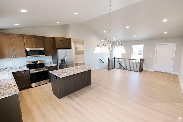 kitchen with a center island, stainless steel appliances, light wood-style flooring, lofted ceiling, and recessed lighting