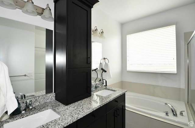 2129 N 3000 W, Plain City, UT 84404 - full bathroom featuring double vanity, a bath, and a sink