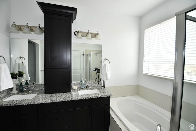 2129 N 3000 W, Plain City, UT 84404 - bathroom featuring double vanity, a stall shower, a garden tub, and a sink