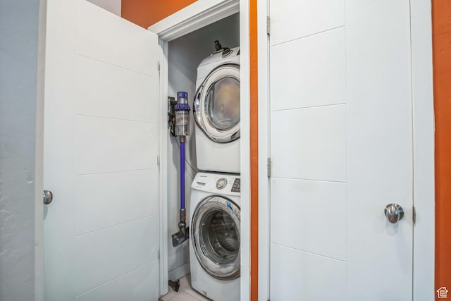 washroom with stacked washer and clothes dryer