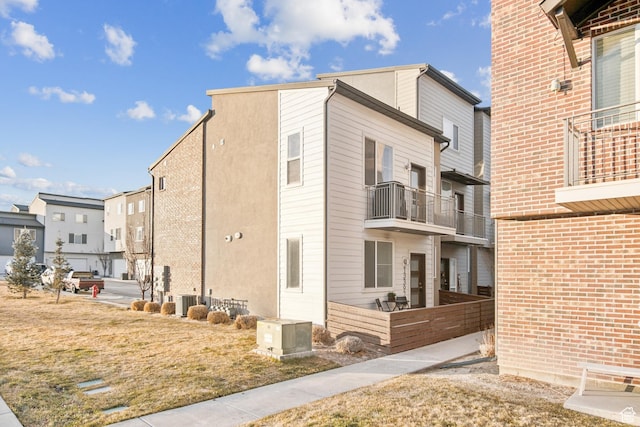 view of side of property with a lawn