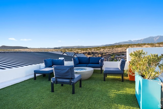 view of yard featuring a mountain view and an outdoor hangout area